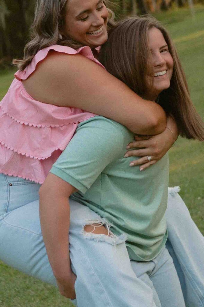 Lgbtq+ couple laughing during their engagement session.