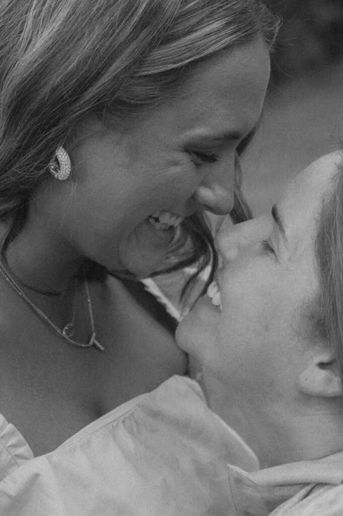 Lgbtq+ couple laughing during their engagement session.