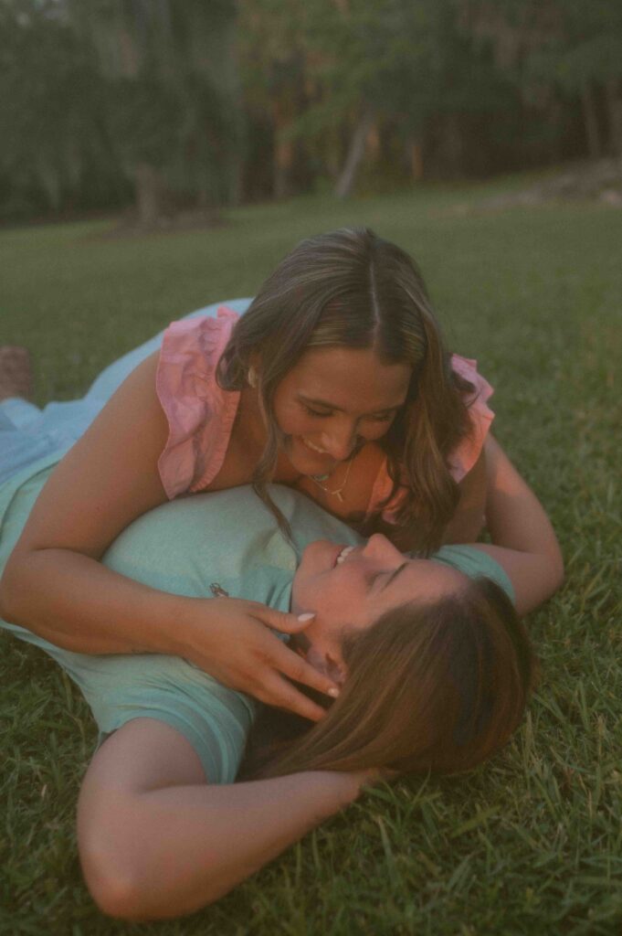 Lgbtq+ couple laughing during their engagement session.