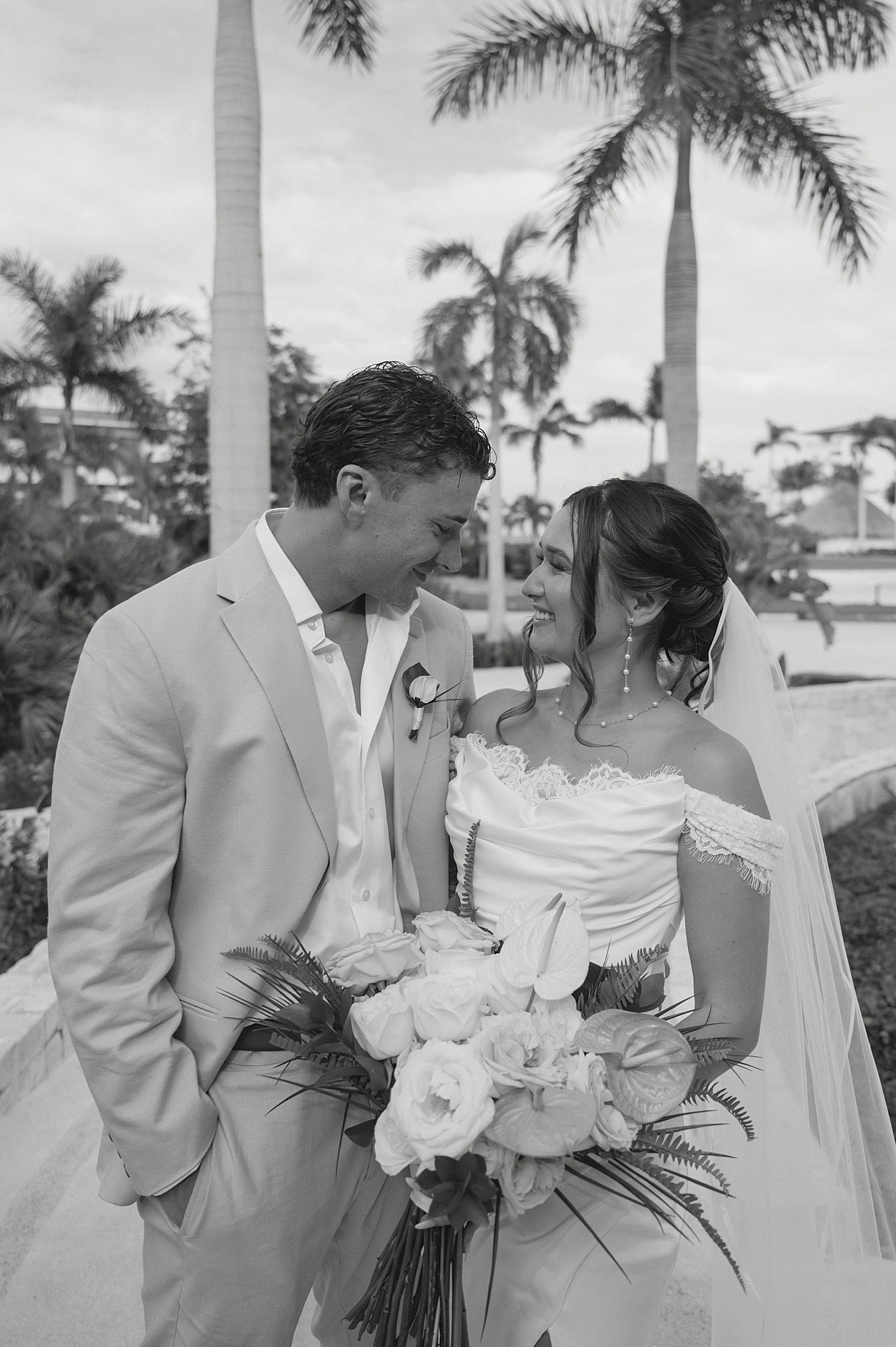 man and woman grin at each other before ceremony by Travel Elopement Photographer