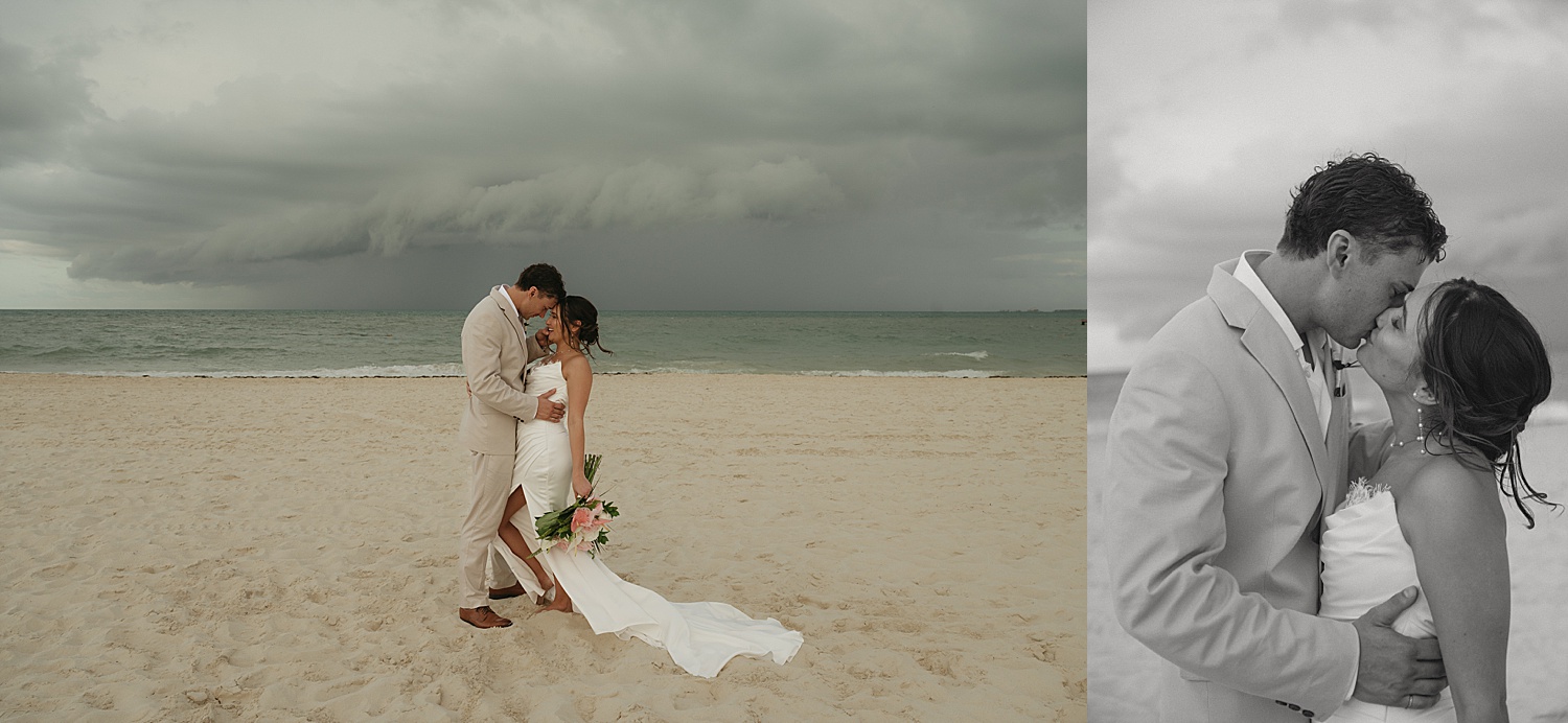 newlyweds share a kiss on the beach with stormy skies beyond at Dreams Playa Mujeres 