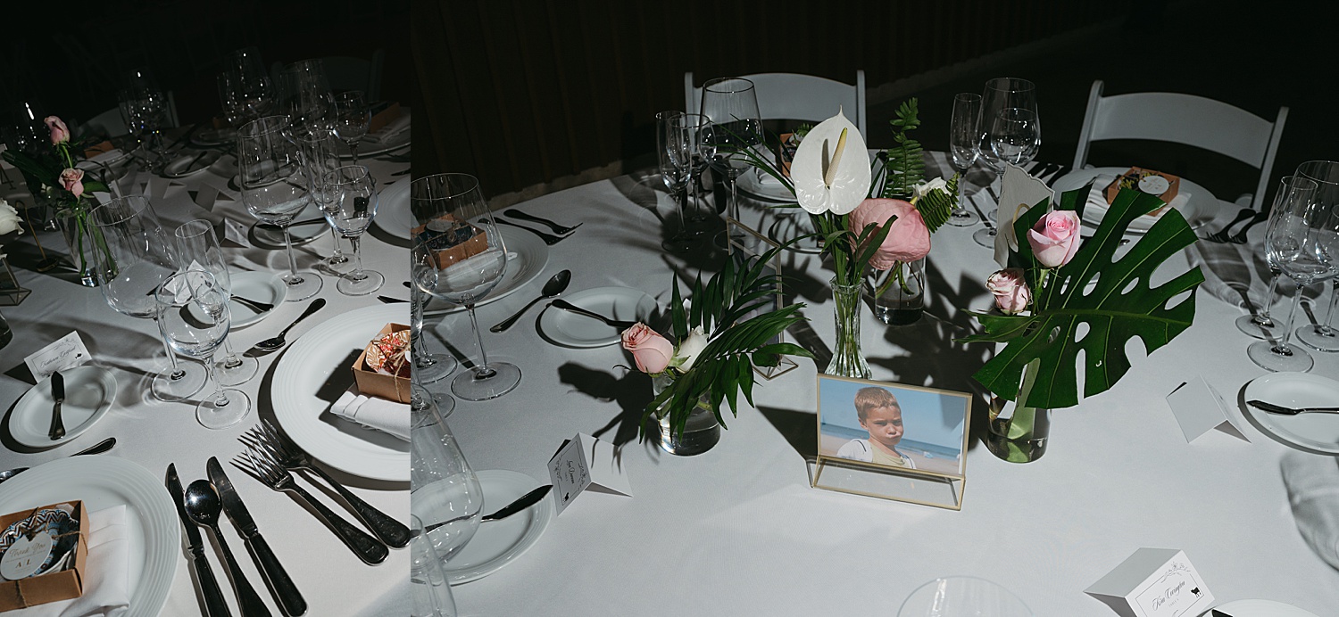 tropical flowers on reception tables by Travel Elopement Photographer