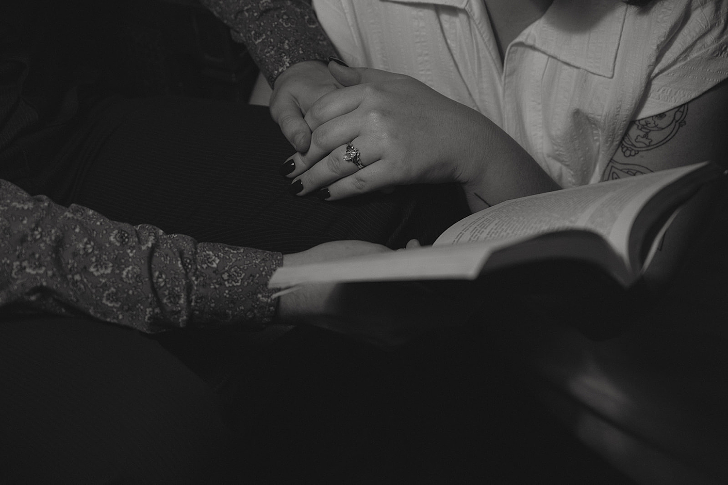 couple cozies up in a bookstore for non-traditional engagement photos